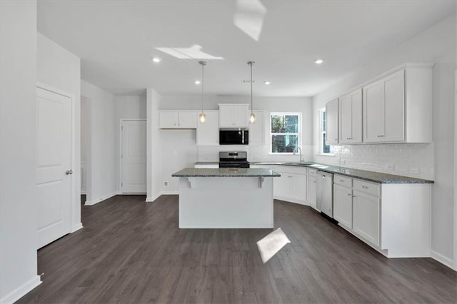 14 Grove Pointe Way SE, Cartersville, GA 30120 - kitchen featuring white cabinets, dark wood-type flooring, stainless steel appliances, and a sink