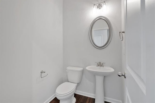 14 Grove Pointe Way SE, Cartersville, GA 30120 - half bathroom featuring toilet, a sink, baseboards, and wood finished floors