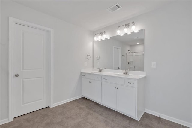 14 Grove Pointe Way SE, Cartersville, GA 30120 - bathroom with double vanity, a stall shower, baseboards, visible vents, and a sink