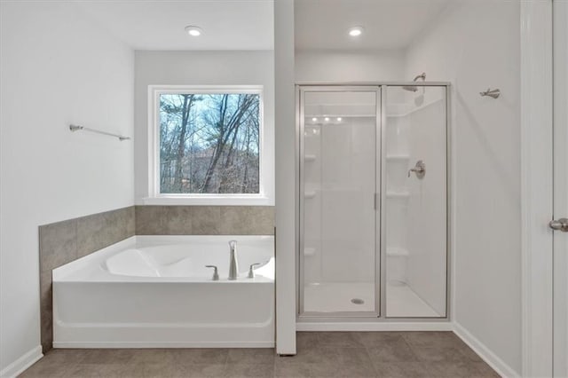 14 Grove Pointe Way SE, Cartersville, GA 30120 - bathroom featuring a stall shower, tile patterned flooring, baseboards, and a bath
