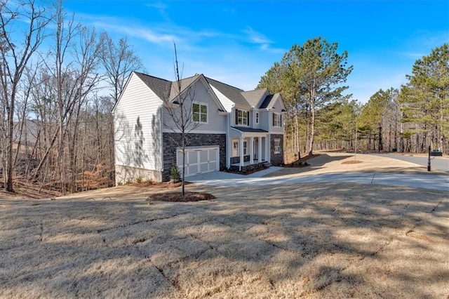14 Grove Pointe Way SE, Cartersville, GA 30120 - view of home's exterior featuring an attached garage, driveway, and stone siding
