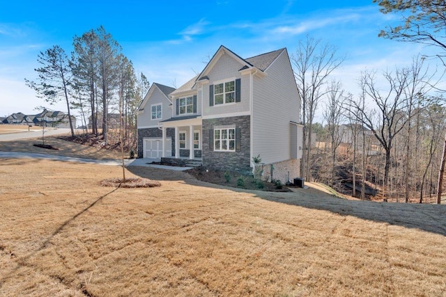 14 Grove Pointe Way SE, Cartersville, GA 30120 - view of front of property featuring a garage, stone siding, and a front yard