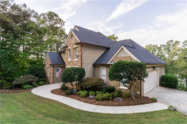 view of front of property with a front yard and a garage