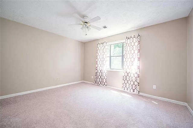 1202 Laurel Cliff Dr SE, Smyrna, GA 30082 - spare room with ceiling fan, carpet, a textured ceiling, and baseboards