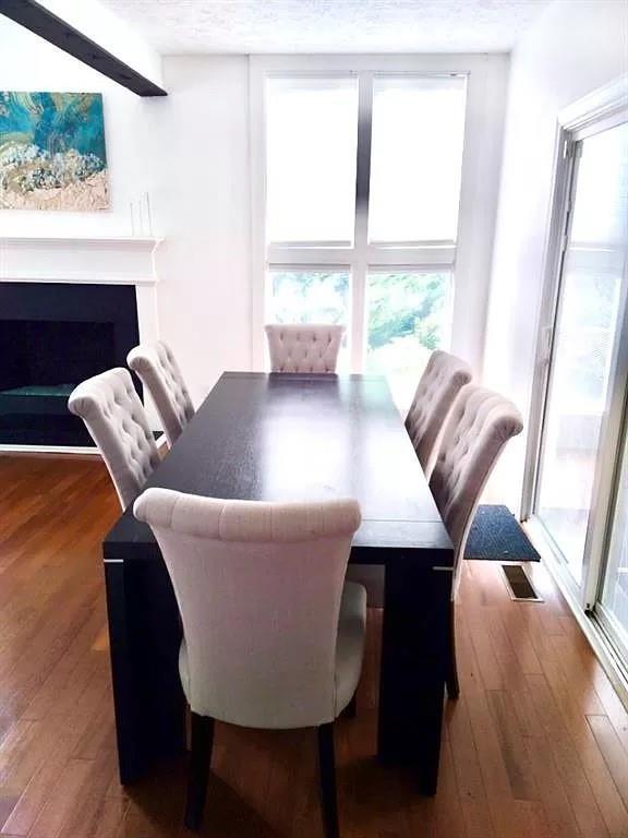 1202 Laurel Cliff Dr SE, Smyrna, GA 30082 - dining space featuring healthy amount of natural light and hardwood / wood-style flooring