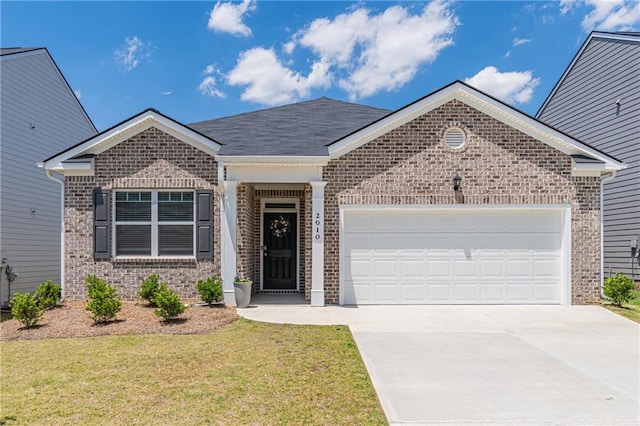2010 Vidalia Ct, Dacula, GA 30019 - ranch-style home featuring brick siding, an attached garage, concrete driveway, and a front lawn