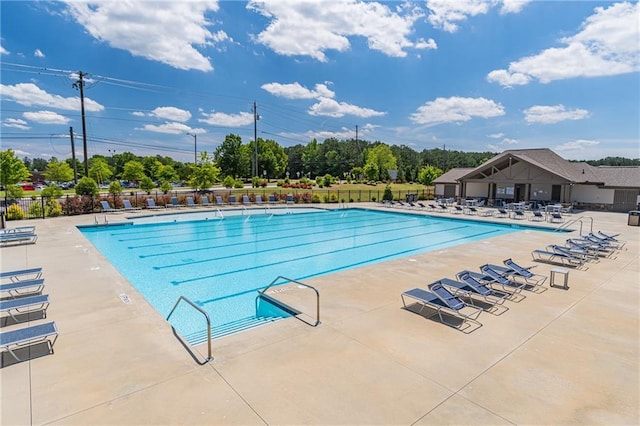 2010 Vidalia Ct, Dacula, GA 30019 - community pool with fence, a patio, and view of wooded area