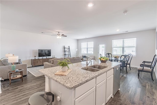 2010 Vidalia Ct, Dacula, GA 30019 - kitchen featuring a sink, dishwasher, a kitchen island with sink, dark wood-style floors, and white cabinets