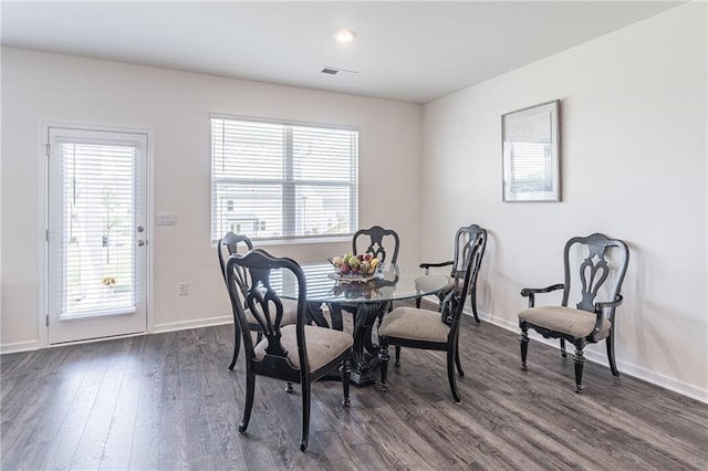 2010 Vidalia Ct, Dacula, GA 30019 - dining area featuring dark wood-type flooring, healthy amount of natural light, and baseboards