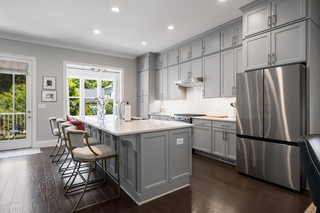 623 Brennan Dr, Decatur, GA 30033 - kitchen with freestanding refrigerator, gray cabinets, a sink, under cabinet range hood, and recessed lighting