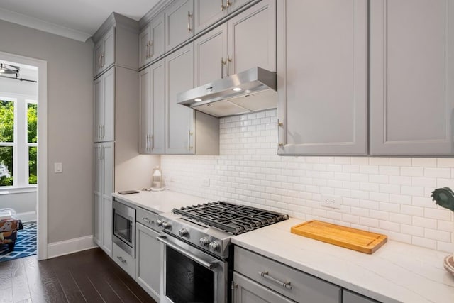 623 Brennan Dr, Decatur, GA 30033 - kitchen with appliances with stainless steel finishes, under cabinet range hood, gray cabinets, baseboards, and ornamental molding