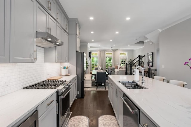 623 Brennan Dr, Decatur, GA 30033 - kitchen with a sink, appliances with stainless steel finishes, under cabinet range hood, recessed lighting, and wine cooler