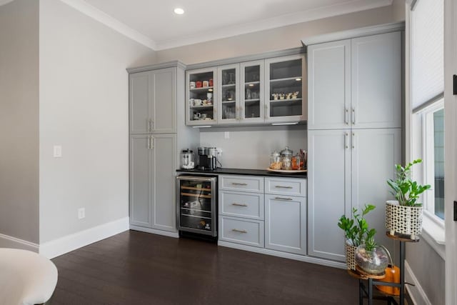 623 Brennan Dr, Decatur, GA 30033 - indoor dry bar featuring beverage cooler, dark wood-type flooring, baseboards, recessed lighting, and crown molding