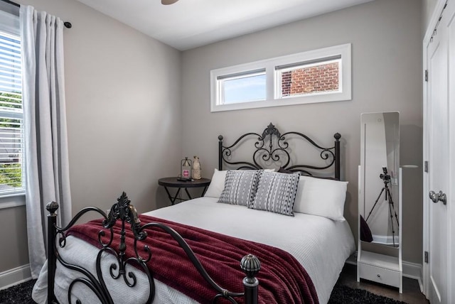 623 Brennan Dr, Decatur, GA 30033 - bedroom with multiple windows, baseboards, and dark carpet