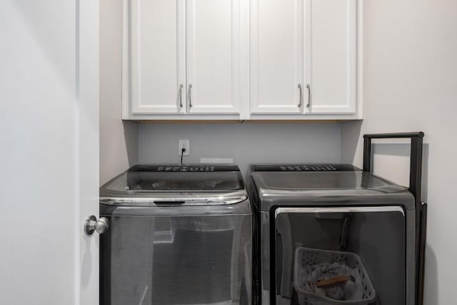 623 Brennan Dr, Decatur, GA 30033 - laundry area featuring washing machine and dryer and cabinet space