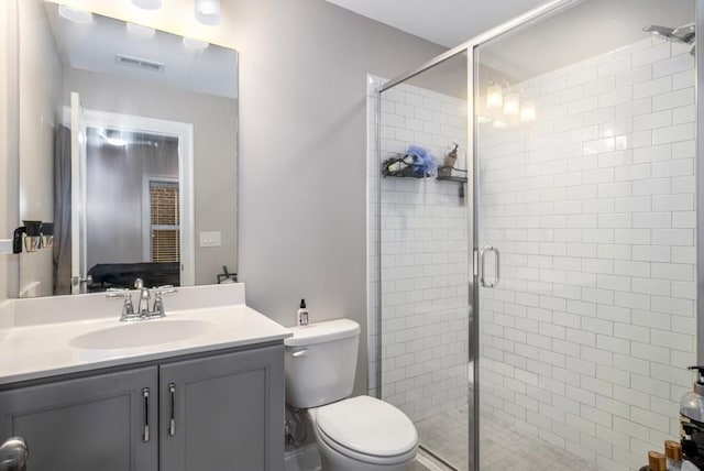 623 Brennan Dr, Decatur, GA 30033 - full bathroom with vanity, a stall shower, and toilet