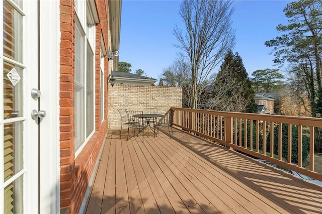wooden deck featuring outdoor dining space