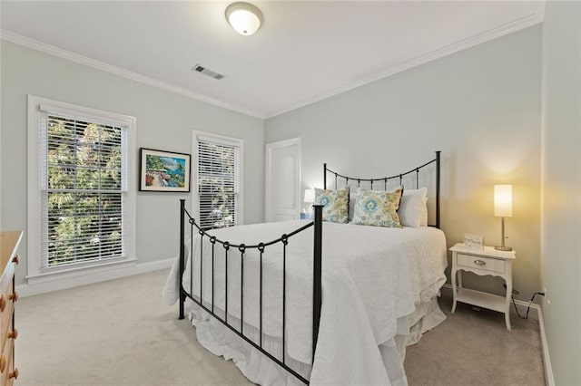 bedroom featuring light carpet, crown molding, and baseboards