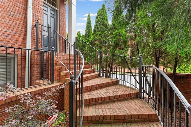 wooden terrace featuring stairs