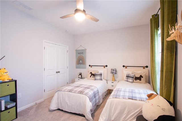 bedroom with carpet, a closet, visible vents, ceiling fan, and baseboards