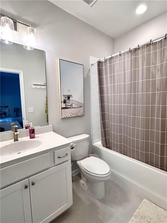 ensuite bathroom featuring tile patterned flooring, toilet, vanity, ensuite bath, and shower / bathtub combination with curtain