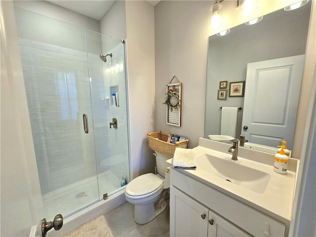 full bath with toilet, tile patterned floors, a shower stall, and vanity