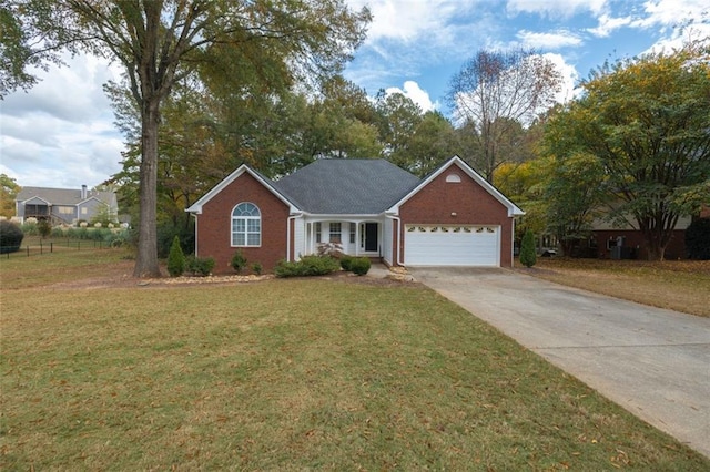 ranch-style house featuring a front yard and a garage