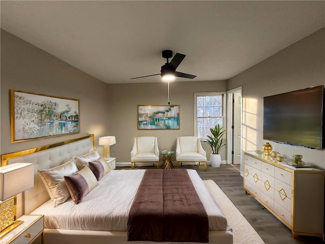 bedroom with dark wood-type flooring and ceiling fan