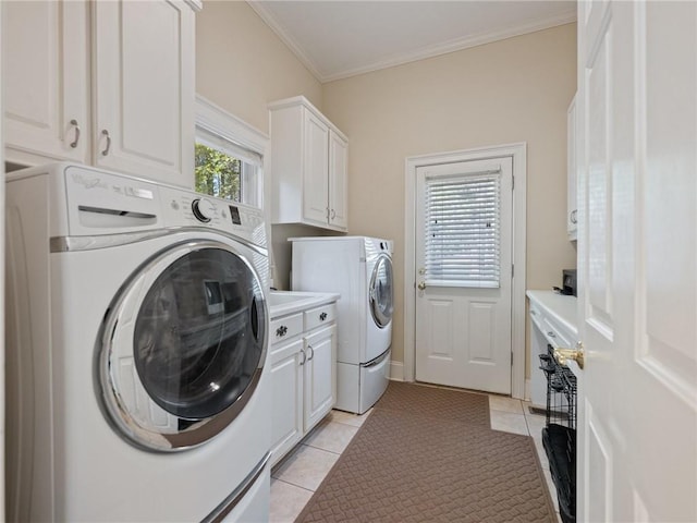 washroom with separate washer and dryer, light tile patterned flooring, cabinet space, and ornamental molding