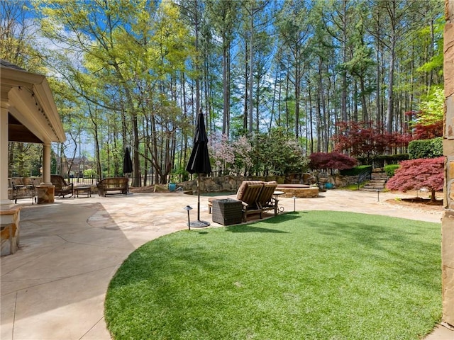 view of yard featuring a patio and fence