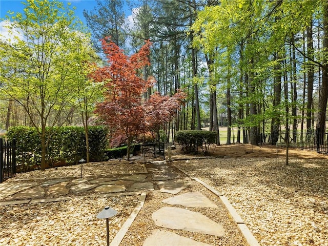 surrounding community featuring fence