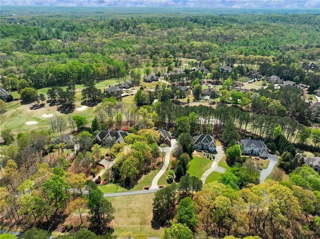 bird's eye view featuring a forest view