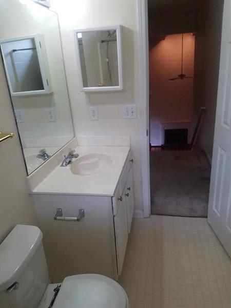bathroom with toilet and vanity