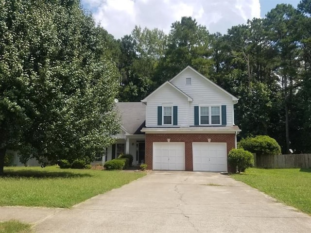 view of front of property featuring fence, an attached garage, brick siding, a front yard, and concrete driveway