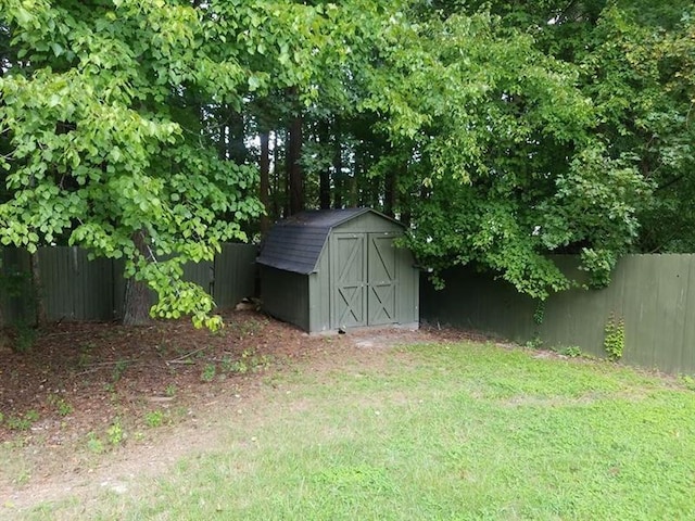 view of shed with fence