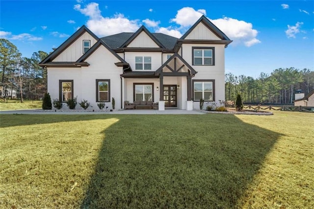 view of front of home with board and batten siding and a front lawn