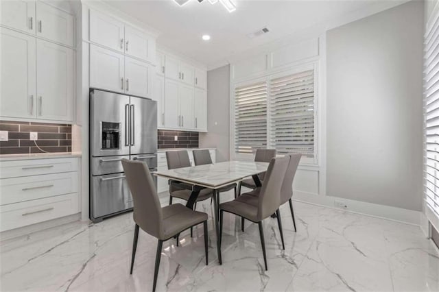 dining room with recessed lighting, visible vents, marble finish floor, and baseboards