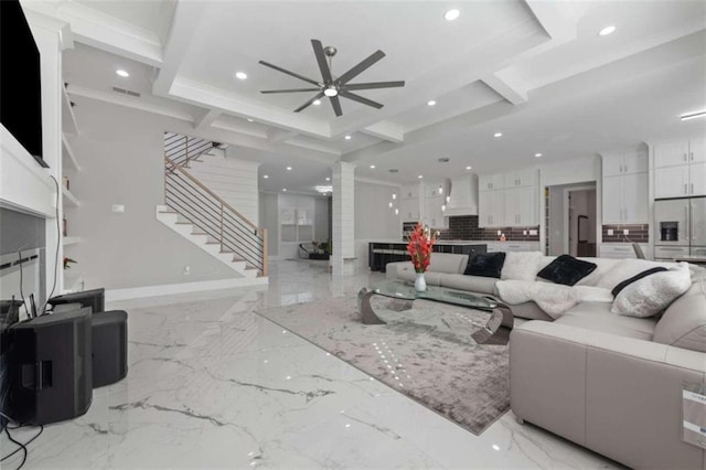 living area with visible vents, recessed lighting, stairs, and ornate columns