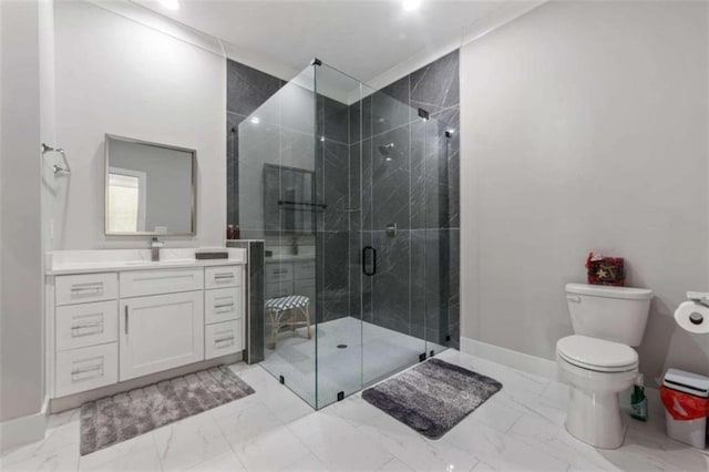 full bath featuring toilet, marble finish floor, a stall shower, baseboards, and vanity