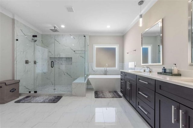 full bath featuring a marble finish shower, a freestanding bath, ornamental molding, marble finish floor, and a sink