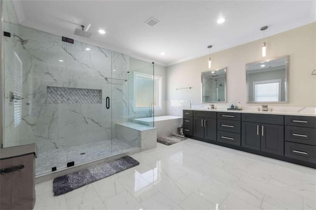 bathroom with a marble finish shower, plenty of natural light, marble finish floor, and a freestanding bath