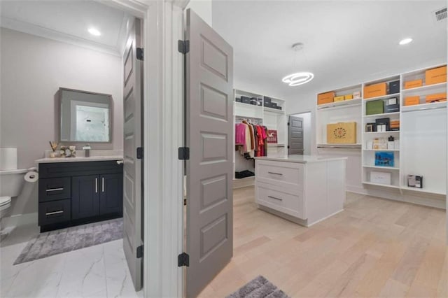 spacious closet with visible vents and marble finish floor