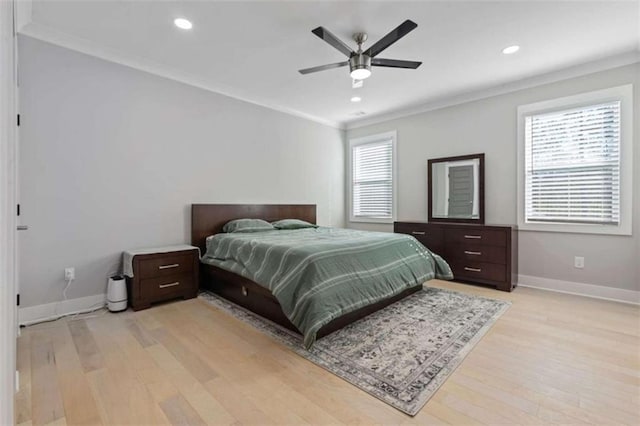 bedroom featuring crown molding, light wood-style flooring, recessed lighting, and baseboards