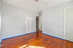 unfurnished room featuring hardwood / wood-style floors