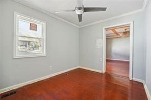 unfurnished room with crown molding, dark wood-type flooring, and ceiling fan