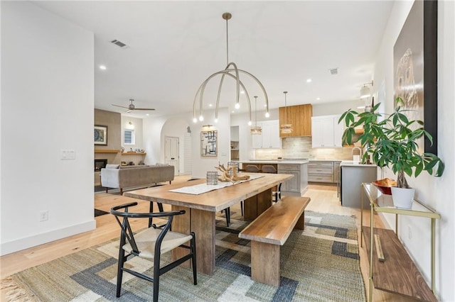 dining room featuring ceiling fan and light hardwood / wood-style flooring