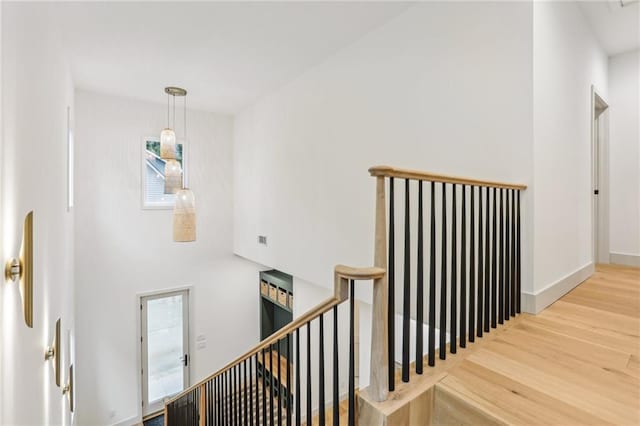 stairway featuring hardwood / wood-style flooring