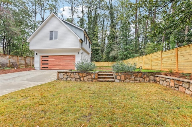 view of side of home with a garage and a lawn