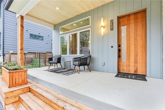 view of exterior entry with a porch