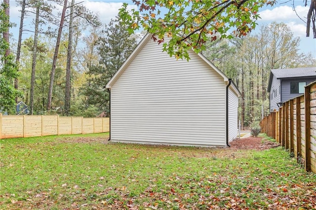 view of side of property with a yard